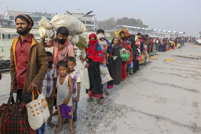 Rohingya refugees headed to the Bhasan Char island prepare to board navy vessels from the south eastern port city of Chattogram, Bangladesh on Feb.15,2021. &copy; 2021 AP Photo 