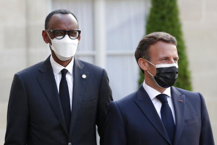 French President Emmanuel Macron, right, welcomes Rwanda President Paul Kagame at a dinner for leaders of African states, at the Elysee Palace, Paris,&nbsp;May 17, 2021.