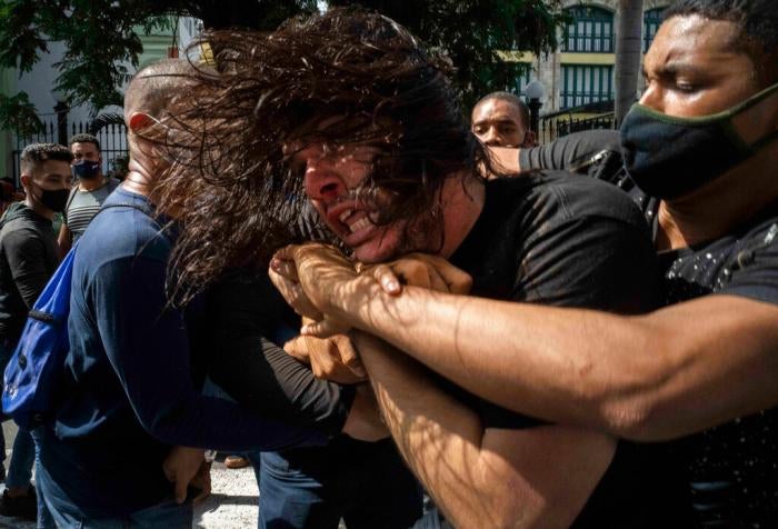 Plainclothes officers detain a protester during a protest in Havana, Cuba, Sunday, July 11, 2021.&nbsp;