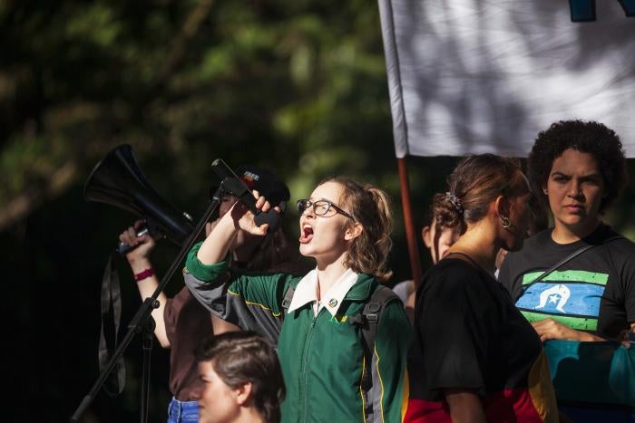 A student protester speaks to the crowd during a climate change protest in Brisbane.