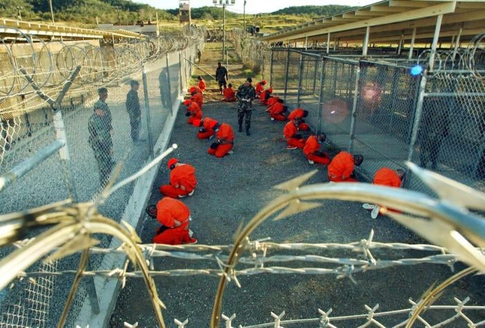 Detainees apprehended after September 11, 2001 in a holding area under surveillance of the US military at Camp X-Ray at the Guantanamo Bay Naval Base, Cuba on January 11, 2002.&nbsp;