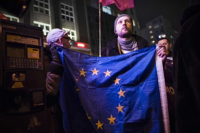 An activist holding the EU flag during a protest in Warsaw against &ldquo;LGBT ideology free zones&rdquo;. &copy;2021 Attila Husejnow / SOPA Images/Sipa USA