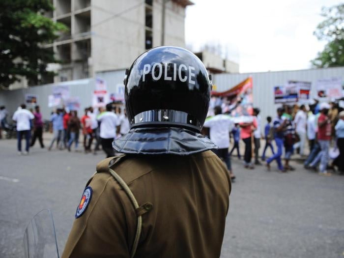 A Sri Lankan policeman keep