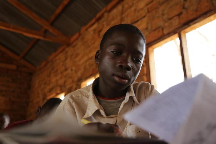 A 13-year-old boy, who mines gold, attends classes in a small-scale mining area in Mbeya Region. Work in mining impacts children&rsquo;s performance and attendance at school. &copy; 2013 Justin Purefoy for Human Rights Watch