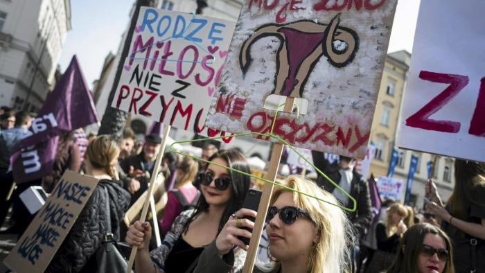 Protesters hold coathangers to illustrate the danger to women’s safety posed by an outright ban on abortion © Reuters
