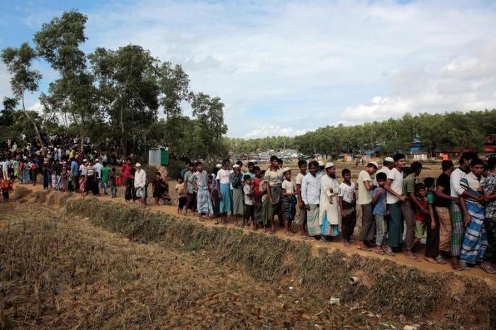 Rohingya refugees wait for blankets to be distributed at Kutupalong camp, near Cox's Bazar, Bangladesh on December 10.