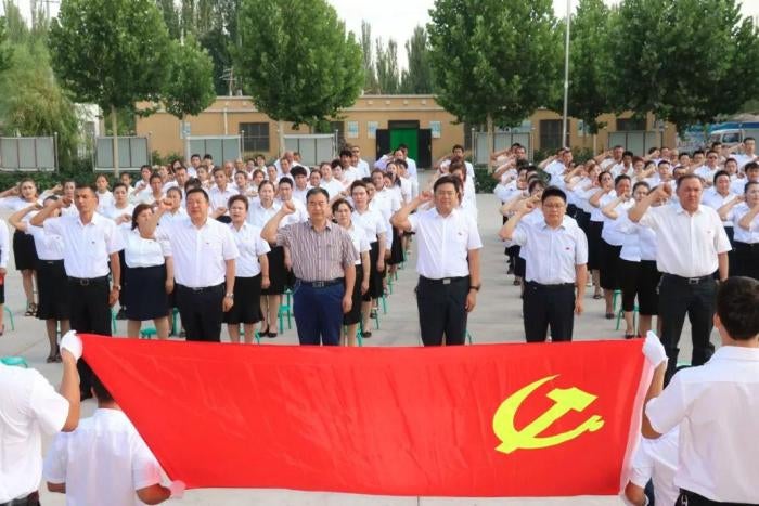 Village officials swear allegiance to the Chinese Communist Party in Kashgar, Xinjiang. 