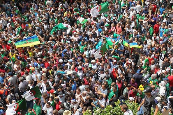 On July 5 2019, thousands of people protested for a twentieth consecutive week in Algeria's capital, defying a major police presence just days before the mandate of interim president Bensalah expires. © AFP/Getty Images