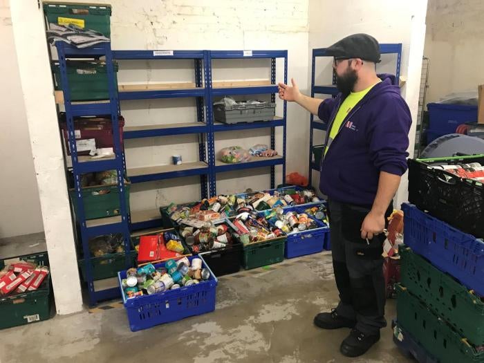 Martin Fuller, who is responsible for MICAH Liverpool&rsquo;s storeroom, explains current low stock levels in the organization&rsquo;s warehouse between a delivery to a food bank distribution and a collection of donations at another church. October 8, 2019. 