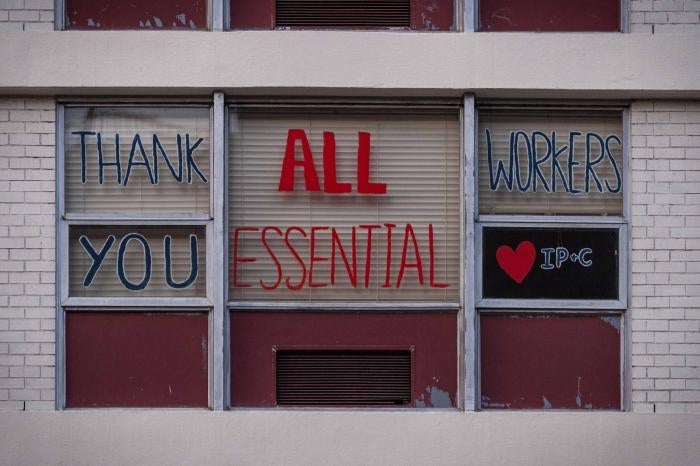 Messages of support for essential workers on a window 