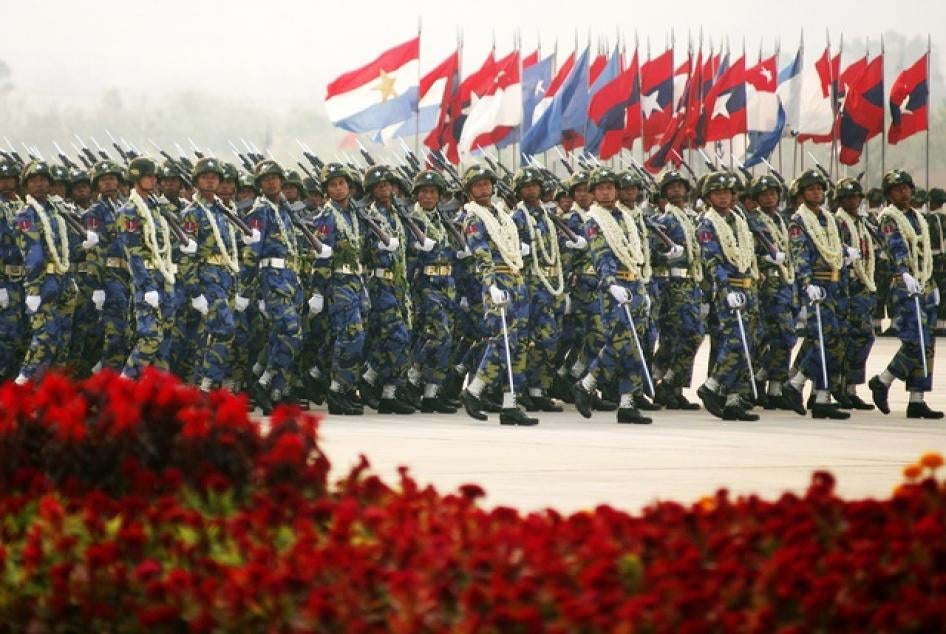 Burma's soldiers carry their weapons as they march during the Armed Forces Day parade in Burma's capital Naypyidaw on March 27, 2010.
