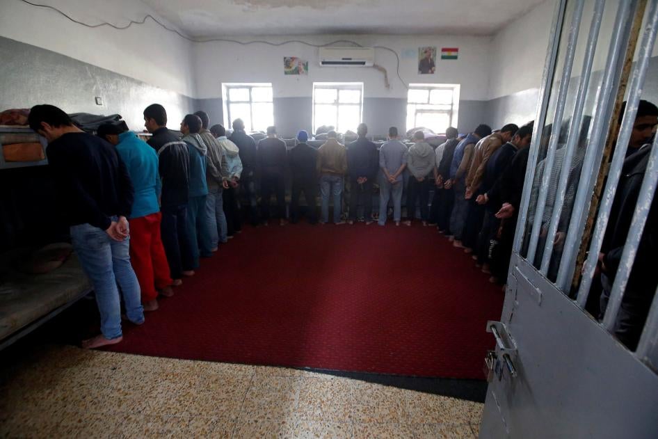 Teenagers stand inside a prison cell at a reform centre in Dohuk, Iraq, February 12, 2017. 
