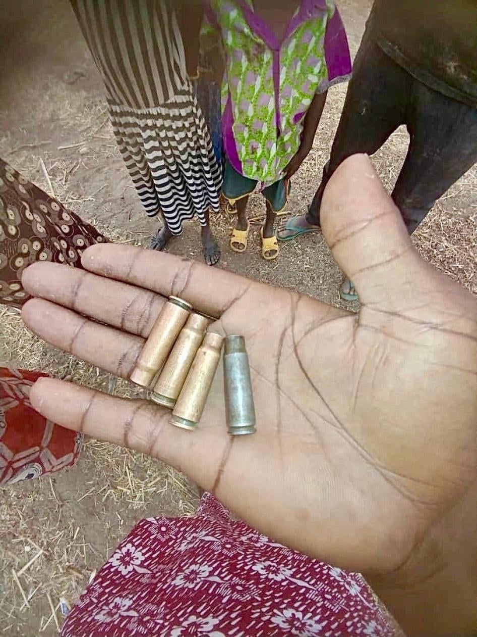 A man displays bullet casings on his palm