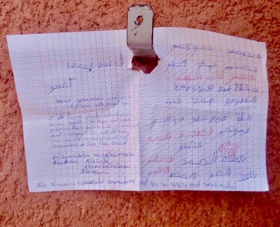 A hand-written note in Arabic