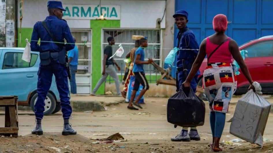 Angolan police patrol streets as people move about during the country's Covid-19 lockdown, Luanda, Angola, March 2020.