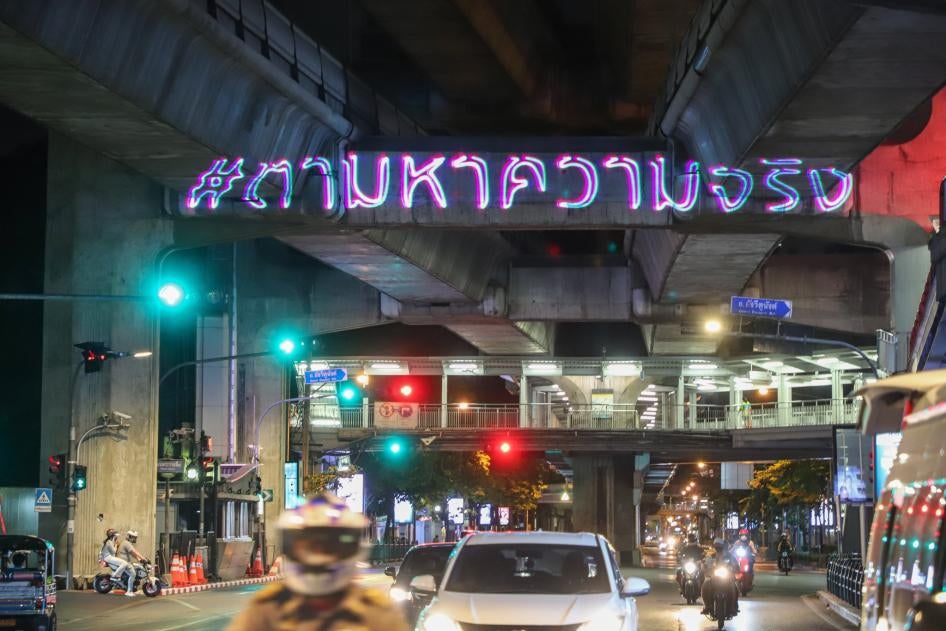Thai activists use laser projectors to display the message “Searching for the Truth,” in remembrance of the 2010 military crackdown on the “Red Shirts” protest, May 2020.