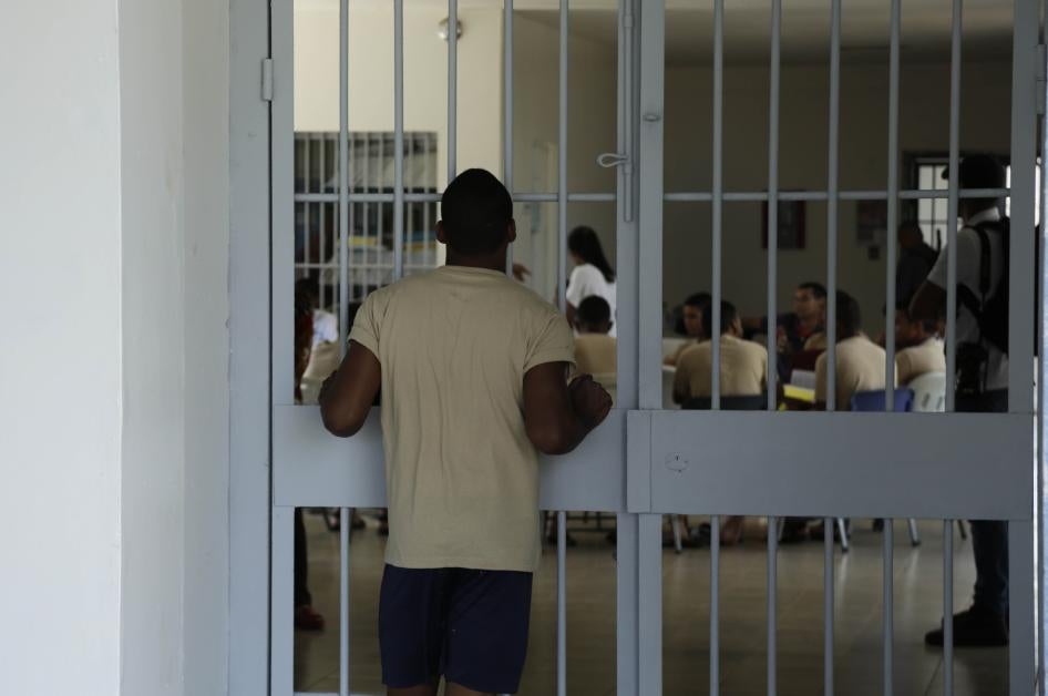 A young inmates looks at another group of fellow inmates during choir practice at the Las Garzas de Pacora detention center, Panama, Wednesday, Jan. 16, 2019.