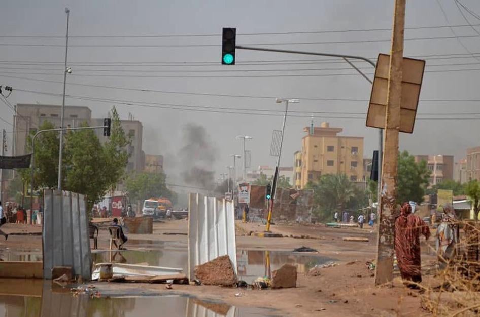 Smoke rises behind barricades laid by protesters in the Sudanese capital Khartoum on Wednesday, June 5, 2019.