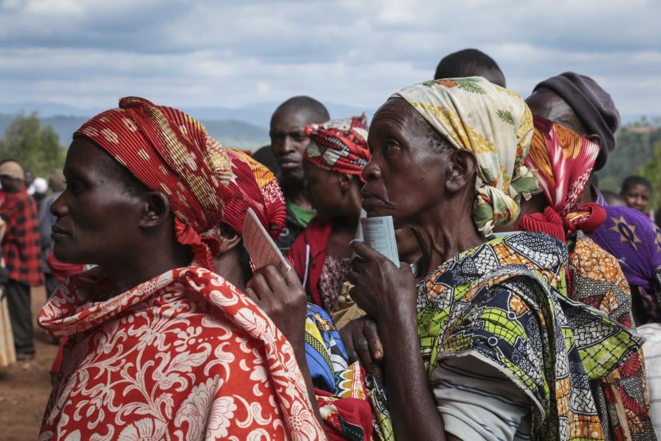 Women queue to cast their votes in the presidential election, in Giheta, Gitega province, Burundi, May 20, 2020.