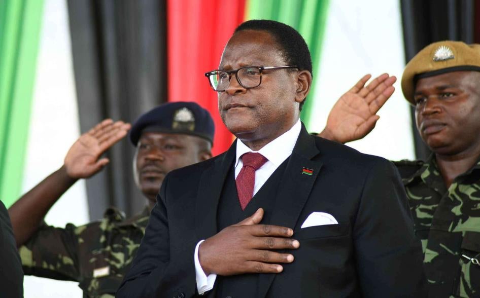 Malawi's newly elected President Lazarus Chakwera takes the oath of office in Lilongwe, Malawi, Sunday June 28, 2020.