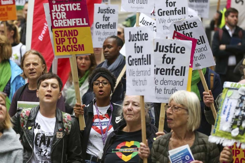 Campaigners hold placards as they take part during the Justice for Grenfell Solidarity rally against the lack of action by the Government following the Grenfell Tower fire, which took the lives of 72 people.