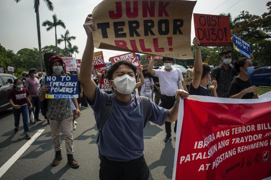 A protester carries a sign at a rally against the draft Anti-Terrorism Act in Quezon City, Philippines, June 4, 2020.
