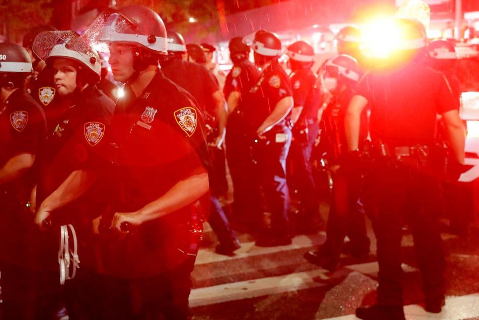Police stand by as other officers arrest protesters in New York, Wednesday, June 3, 2020.