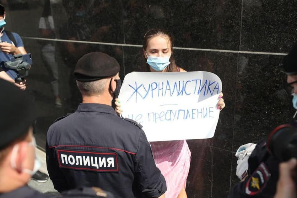 Olga Churakova stands in front of the FSB building in Moscow with a placard reading “Journalism is not a crime”, July 7, 2020.