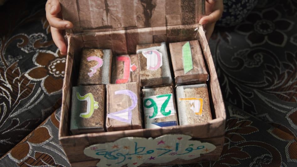 Hanan, a Syrian refugee in Jordan, created learning ‘blocks’ for her children from discarded cigarette cases.