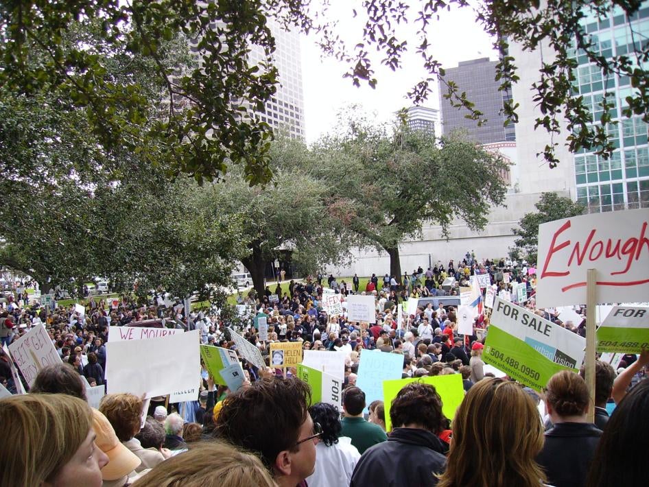 People protest in front of the storm damaged city hall in New Orleans, Louisiana, over the city’s response to Hurricane Katrina, 2006.