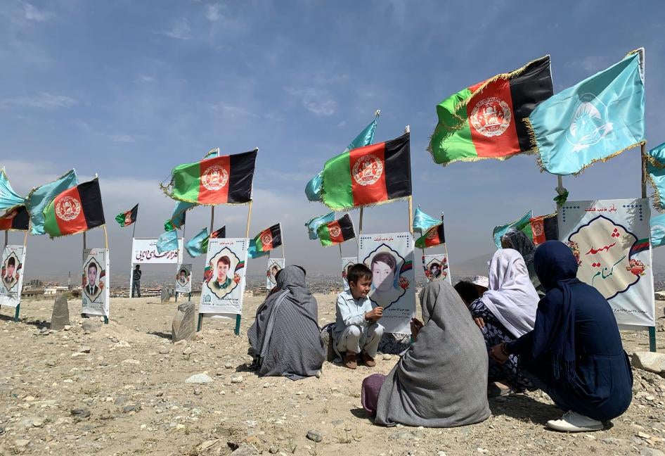 Friends and families of people killed in the conflict gathered in a cemetery to call for a ceasefire from the parties to the intra-Afghan peace talks taking place in Doha, Qatar, September 14, 2020.