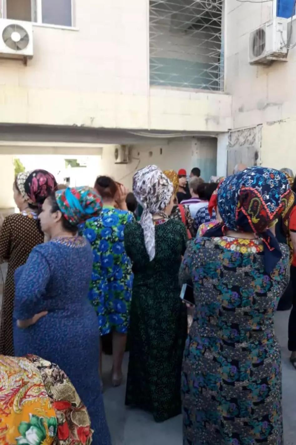 People waiting inside a shop in Ashgabat.