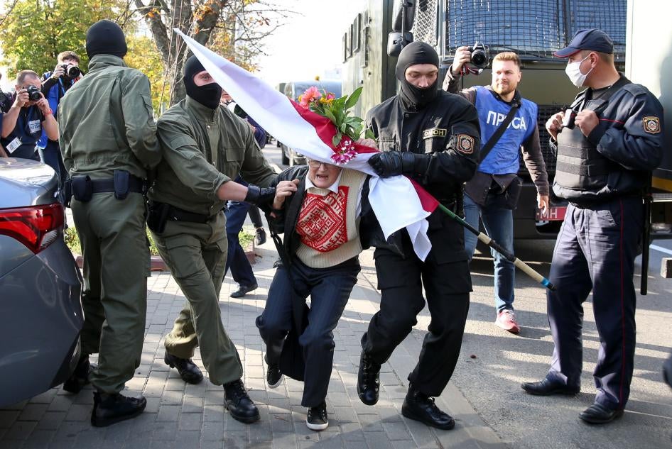 Police officers detain Nina Bahinskaya, 73, during an opposition rally to protest the official presidential election results in Minsk, Belarus, September 19, 2020.