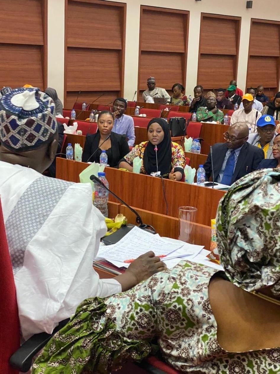 Hauwa Ojeifo (center) together with Human Rights Watch researcher Anietie Ewang (left), speaks before the Nigerian National Assembly on the draft mental health bill on February 17, 2020. 