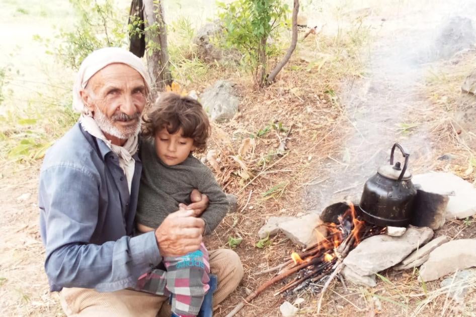 Servet Turgut died on September 30 of injuries incurred while in military custody. Pictured here in his village with his grandchild. ©2020 Private