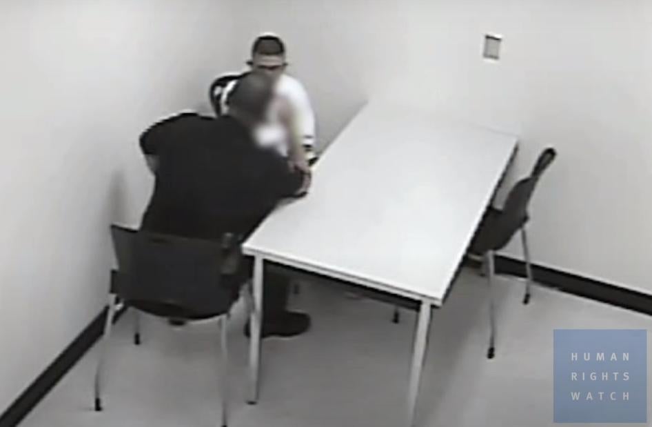 An image of a police officer interrogating a youth, using techniques that ultimately pressured the youth to confess to a crime he did not commit.  ​