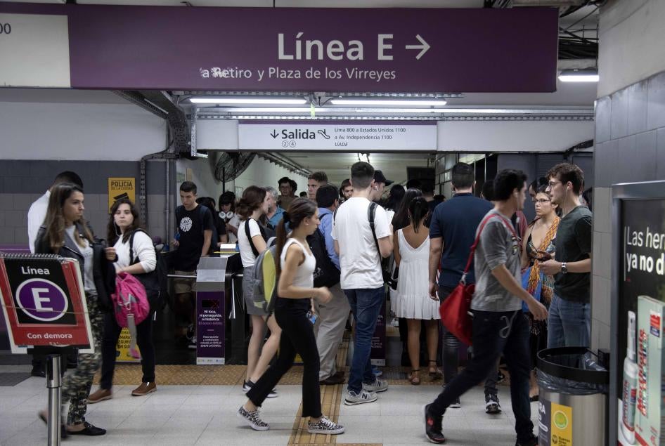 Commuters walk through an overcrowded subway station during local rush hour on March 13, 2020 in Buenos Aires, Argentina.