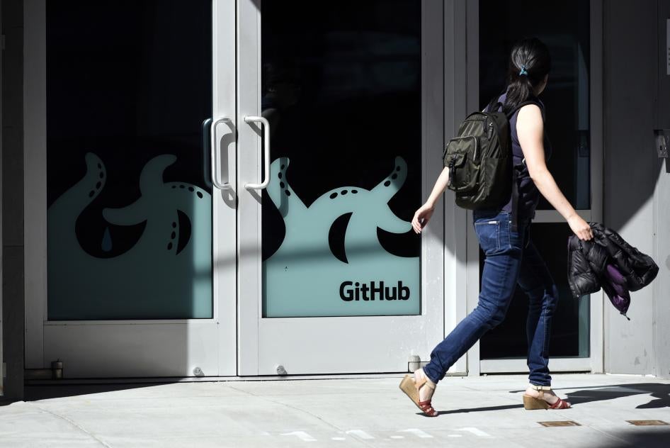 A pedestrian walks past the GitHub Inc. offices in San Francisco, California, United States