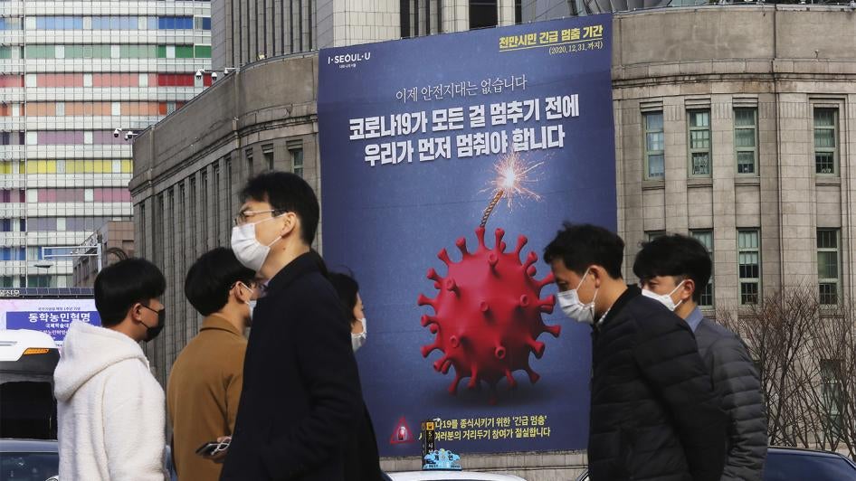 A banner emphasizing enhanced social distancing is displayed at Seoul City Hall in Seoul, South Korea on November 25, 2020. © 2020 AP Photo/Ahn Young-joon