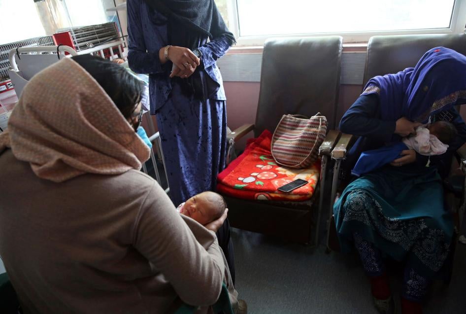 A mother, right, breastfeeds her two-day-old baby at the Ataturk Children's Hospital in Kabul, Afghanistan, May 13, 2020. 