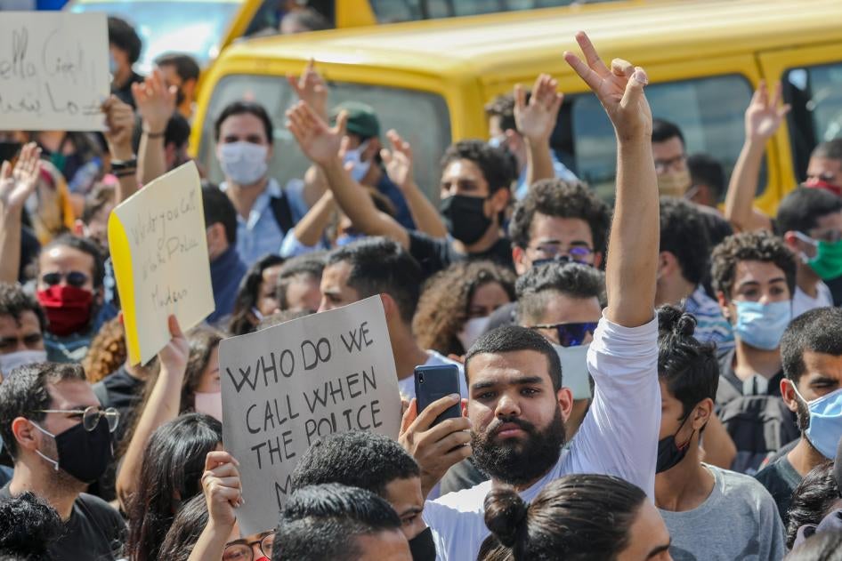 Saif Ayadi, LGBT rights activist at Damj Association, surrounded by protesters on October 6, 2020.