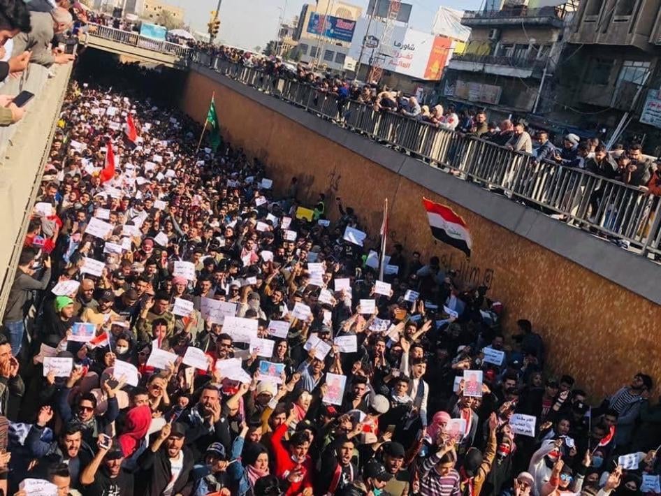 Protesters marching in Al-Tahrir Square Tunnel in Baghdad, Iraq.