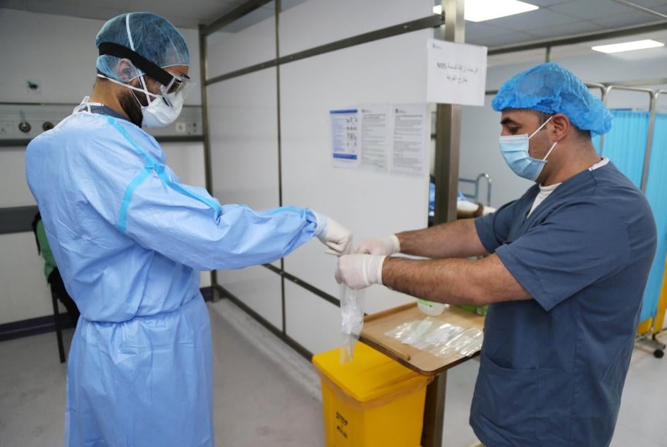 A doctor, wearing protective gear, handles a test for the coronavirus disease (COVID-19), at Rafik Hariri University Hospital, in Beirut, Lebanon October 1, 2020