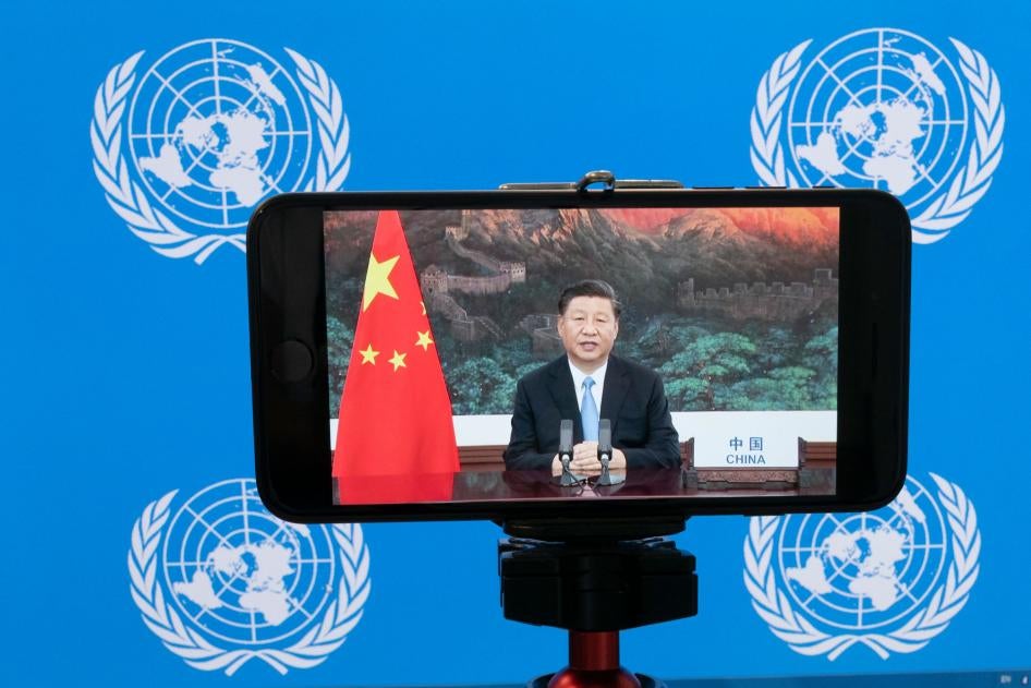 Chinese President Xi Jinping is seen on a phone screen remotely addressing the 75th session of the United Nations General Assembly, September 22, 2020. 