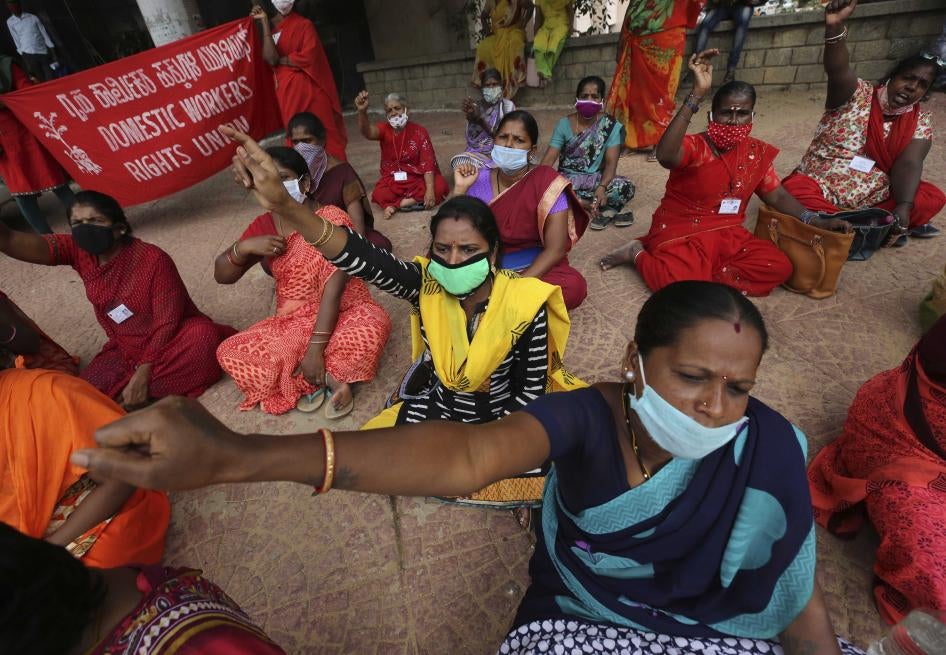 Women domestic workers, many of whom lost their jobs after the coronavirus outbreak, shout slogans at a protest demanding social security from the government in Bengaluru, India, June 15, 2020.