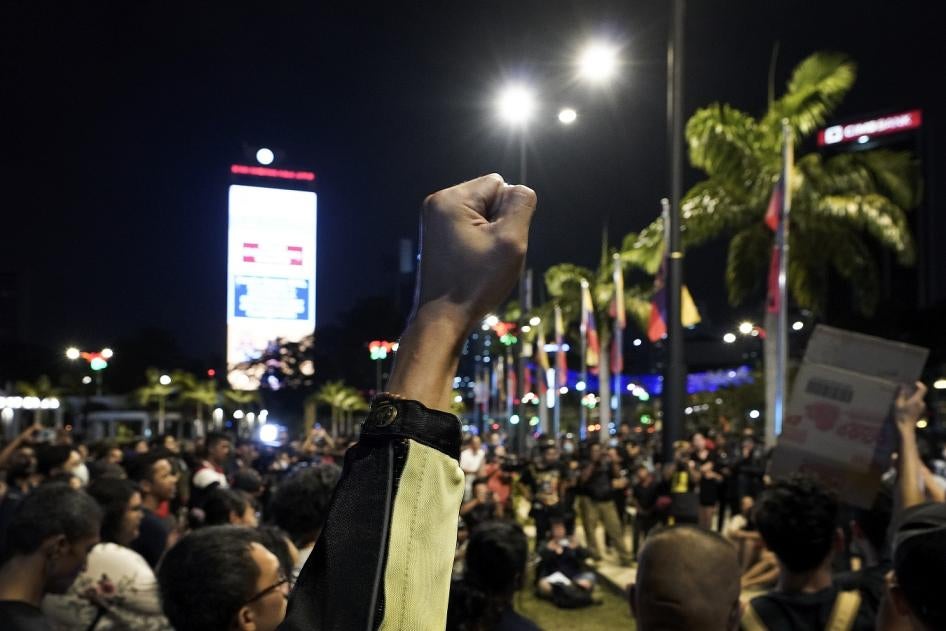 A protester raises his fist during a demonstration after politician Muhyiddin Yassin was appointed as the new prime minister in Kuala Lumpur, Malaysia, Saturday, Feb. 29, 2020. 