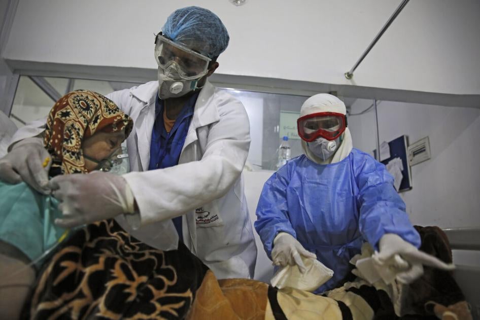 Medical workers attend to a Covid-19 patient in an intensive care unit at a hospital in Sanaa, Yemen, June 14, 2020. 