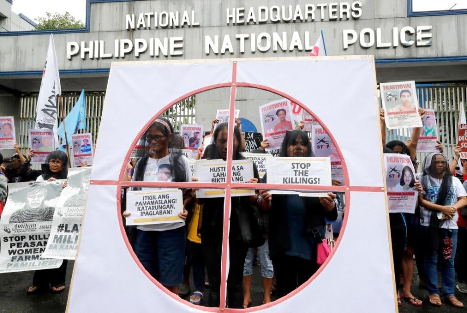 Veiled protesters, mostly relatives of victims of alleged extrajudicial killings by the police