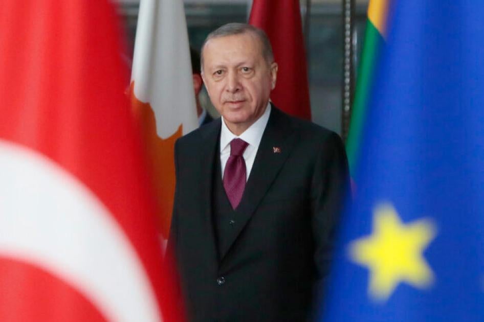 Turkish President Recep Tayyip Erdogan arrives for a meeting with European Council President Charles Michel at the European Council building in Brussels, Monday, March 9, 2020.