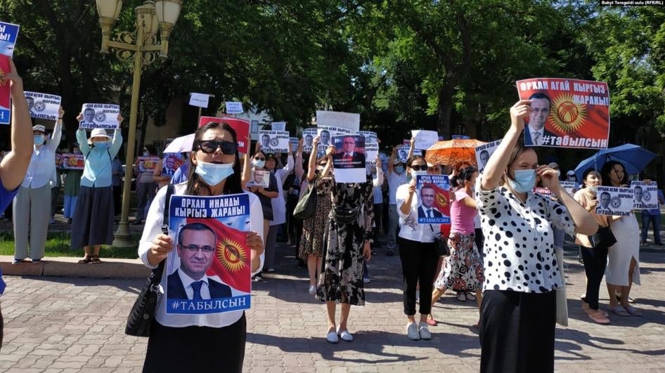Protestors in central Bishkek demanding Orhan Inandi, who disappeared on May 31, be found, hold posters with his image that read “Orhan Inandi is a Kyrgyz citizen! He should be found!”